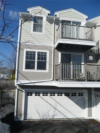 Front view of a multi-story house with a double garage.