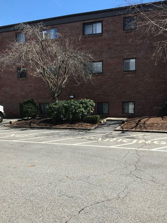 Front view of a brick residential building.