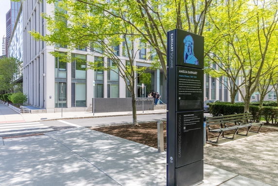 Front view of a modern multi-story building with large windows.