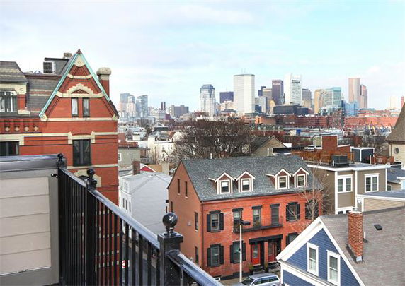 Panoramic view of a cityscape with various buildings and skyscrapers.