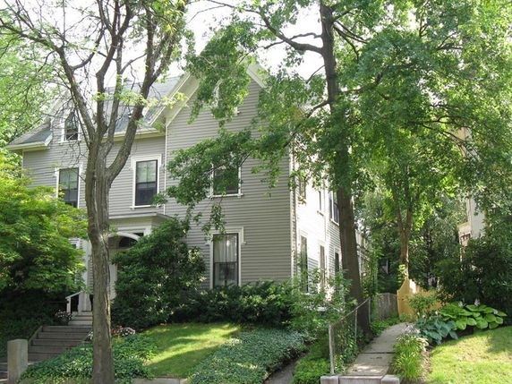 Front view of a two-story house with a gabled roof.