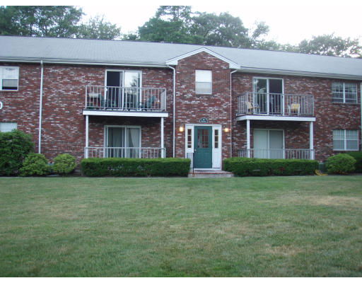 Front view of a two-story brick building with balconies.