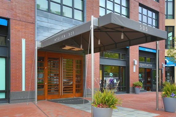 Front entrance of a commercial building with a canopy.