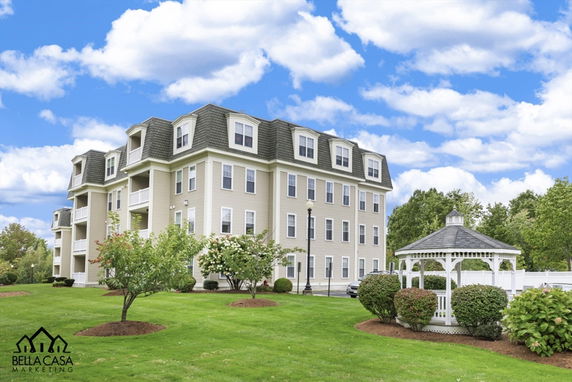 Front view of a multi-story apartment building with a traditional design.