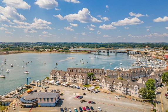 Panoramic view of a waterfront area with buildings and boats.