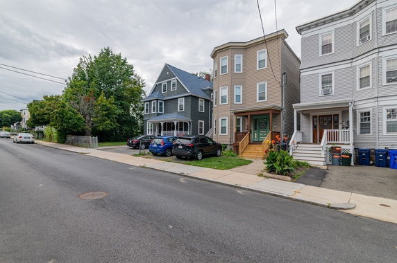 Front view of a row of multi-story townhouses.