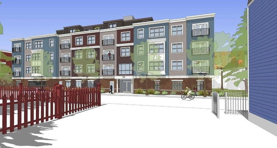 Front view of a multi-story residential building with balconies.