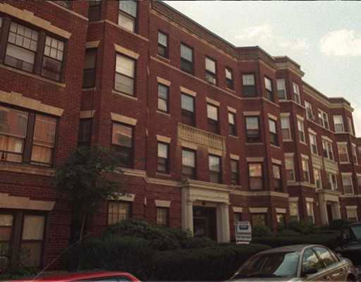 Front view of a multi-story brick apartment building