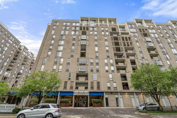 Front view of a multi-story condominium building.