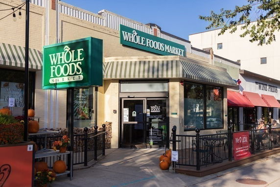 Front view of a store with a prominent sign.