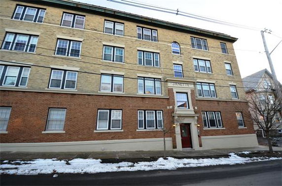 Front view of a multi-story apartment building.
