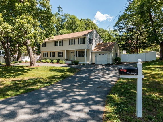 Front view of a two-story house with attached garage.
