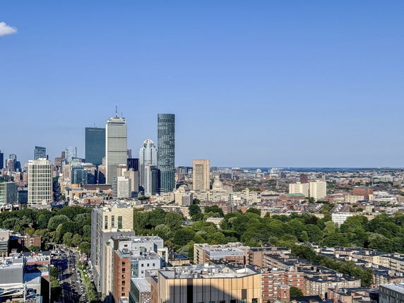 Wide-angle view of a city skyline with various tall buildings.