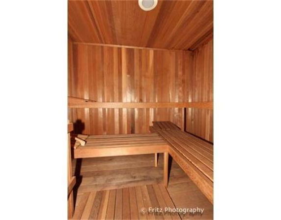 Interior view of a wooden sauna room with benches.