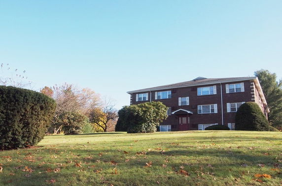 Front view of a multi-story brick building.