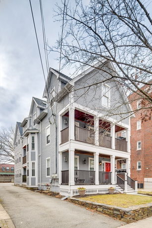Front view of a multi-story residential building with balconies.