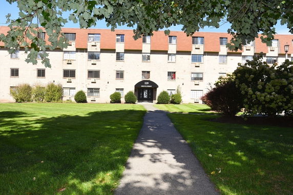 Front view of a multi-story residential building.