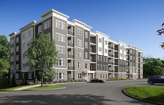 Front view of a multi-story apartment building with a modern facade.
