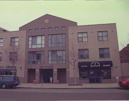 Front view of a multi-story commercial building with a symmetrical facade.