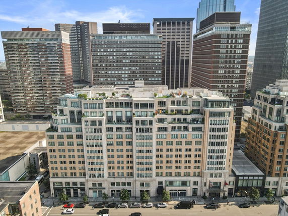 Front view of a multi-story residential building in an urban area.