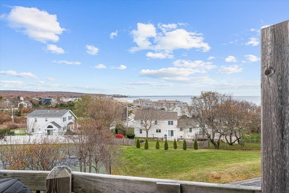 View of houses and landscape extending towards the ocean.