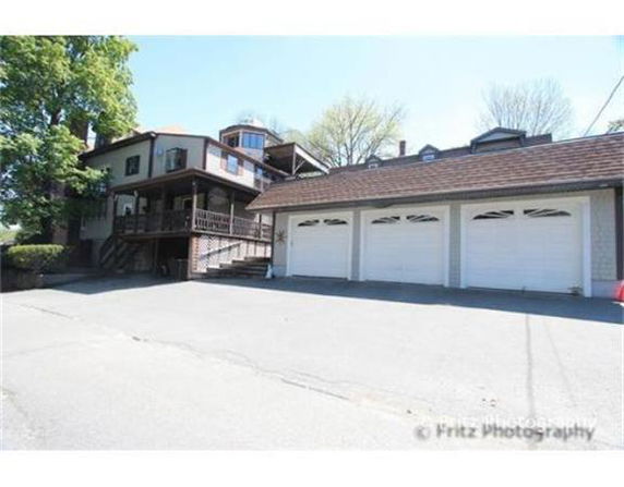 Front view of a multi-story house with attached garage