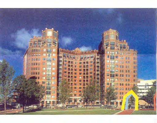 Front view of a large multi-story residential building with a unique architectural design.