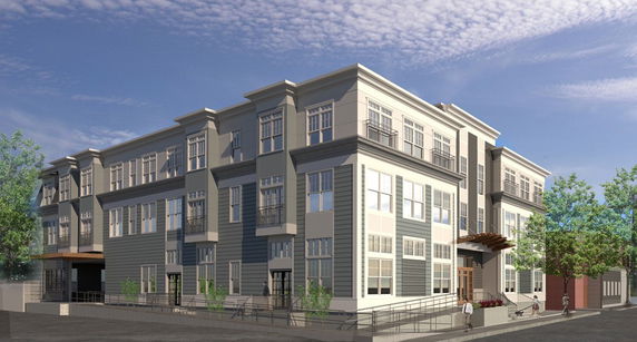 Front view of a multi-story residential building with large windows and a modern design.