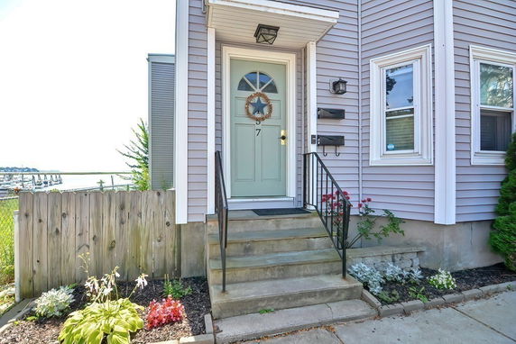 Front view of a house with a light-colored door and windows.