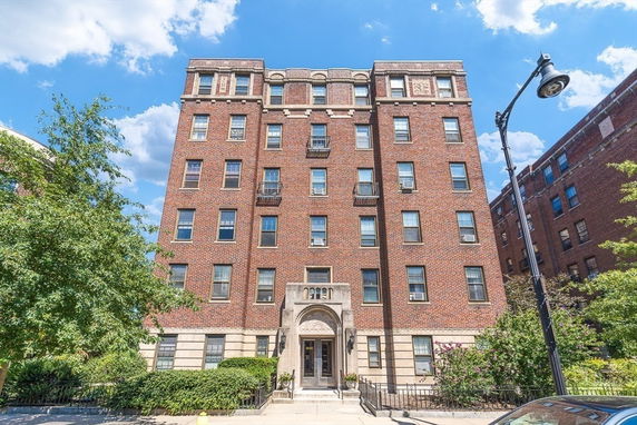 Front view of a multi-story brick building.