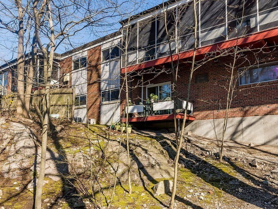 Elevated view of a brick building with balconies.