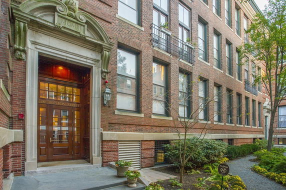 Front view of a multistory brick building entrance.