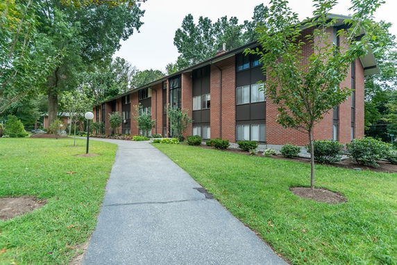 Front view of a two-story brick apartment building.
