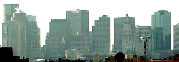 Panoramic view of a city skyline with multiple high-rise buildings.
