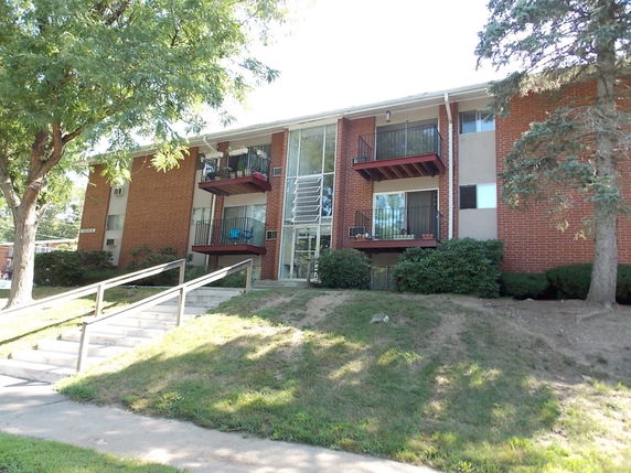 Front view of a multi-story building with balconies.