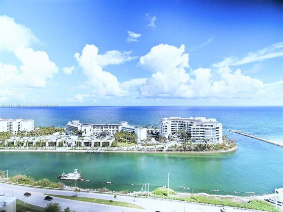 Aerial view of a coastal area with large buildings near the ocean.