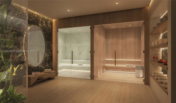 Interior view of a luxury spa room with a sauna and steam room, and shelves with towels and beverages.