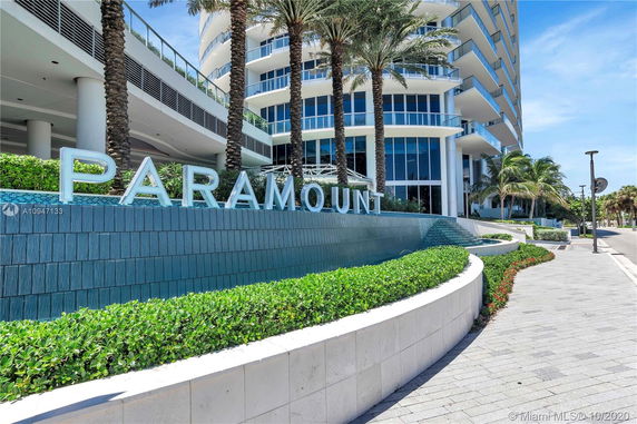 Front view of a modern high-rise building with balconies.