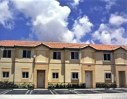 Front view of a two-story residential building with multiple units.