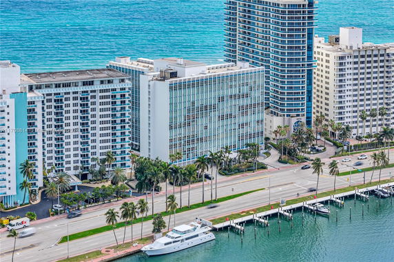 Aerial view of high-rise buildings near a waterfront.