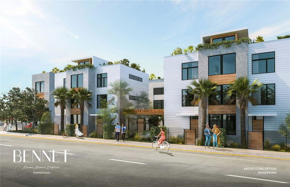 Front view of a modern townhouse complex with multiple stories and large windows.