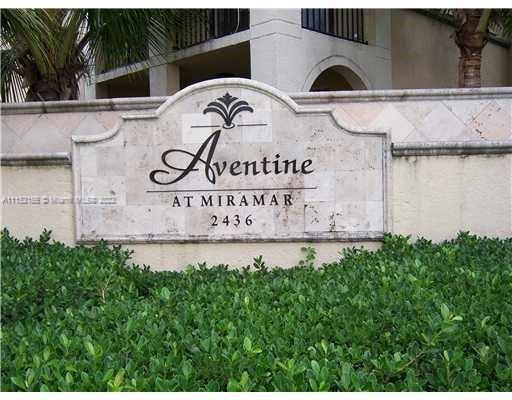 Front view of a building with a stone sign reading 'Aventine at Miramar 2436'.