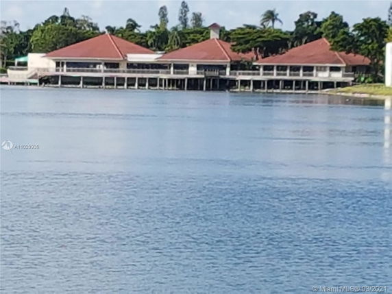 Panoramic view of buildings with red roofs near a body of water