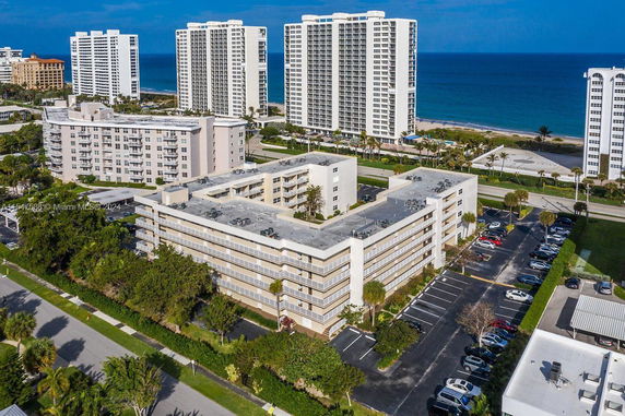 Aerial view of mid-rise residential buildings near the coastline.