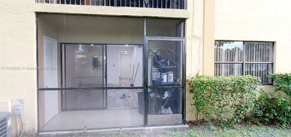 Front view of a building with a screened entrance