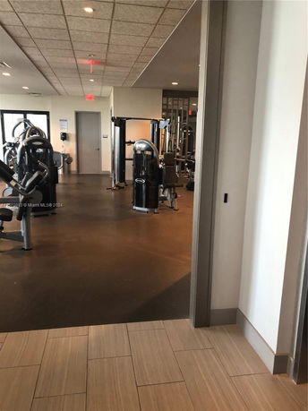 Interior view of a gym area with various exercise machines.