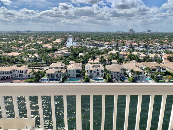 Panoramic view from a high vantage point overlooking a suburban area with canals and houses.