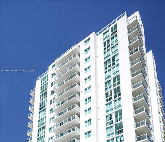 Front view of a high-rise building with multiple balconies.