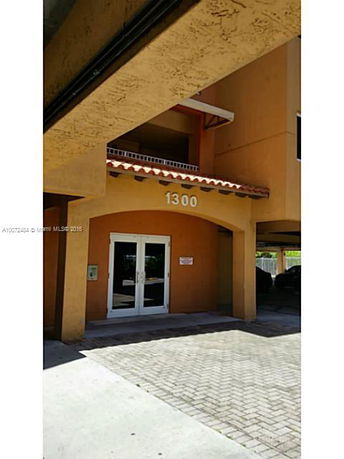 Front view of a building entrance with the number 1300.