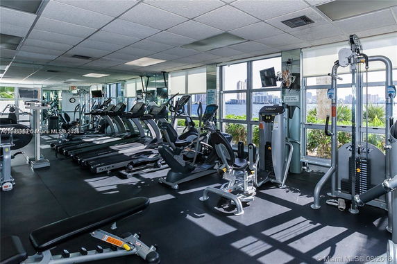 Interior view of a gym with treadmills and exercise equipment.